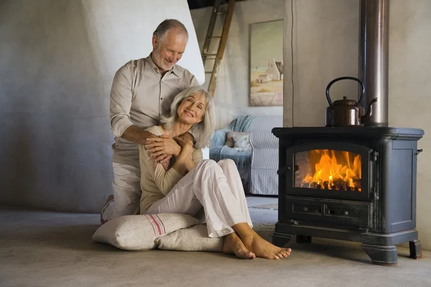 couple at home with log burner