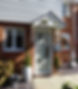 Mint green composite front door at house