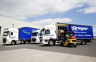 three lorries being loaded