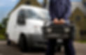 plumber with toolbox and van