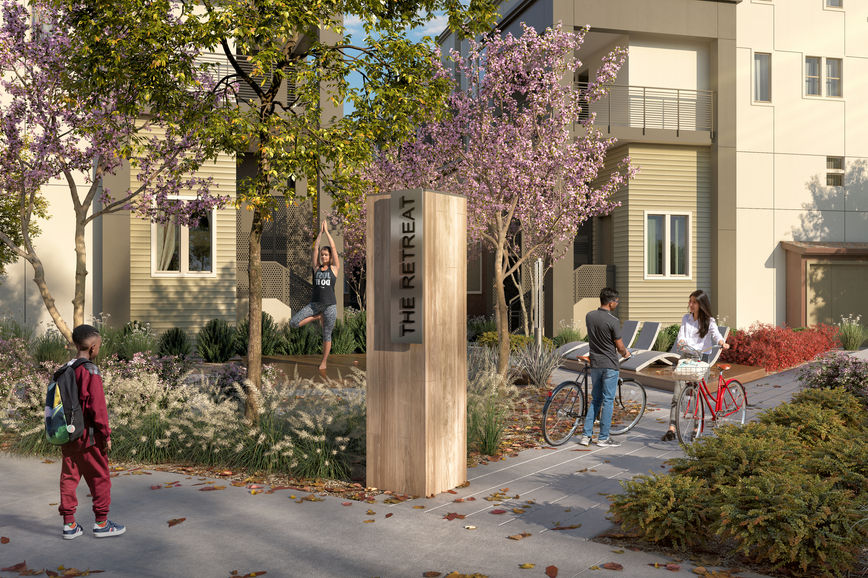 Paseo with signage, flowering trees and residents at Brookfield Boulevard