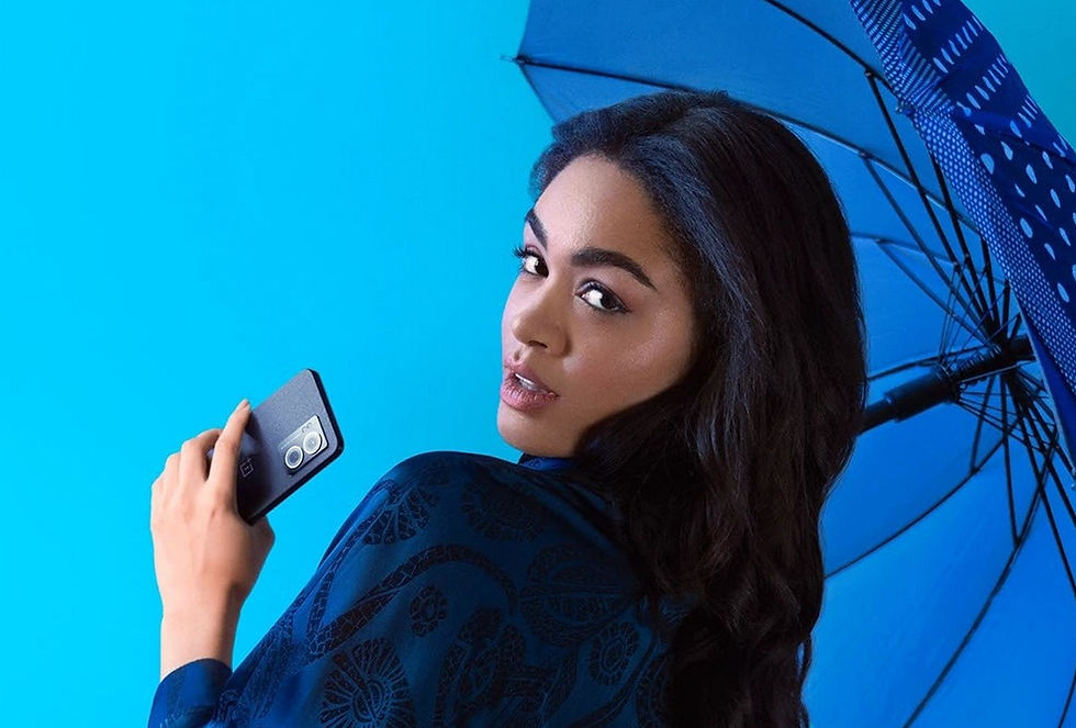 Promotional render of OnePlus N300 Phone showing a woman taking a selfie, by Transparent House
