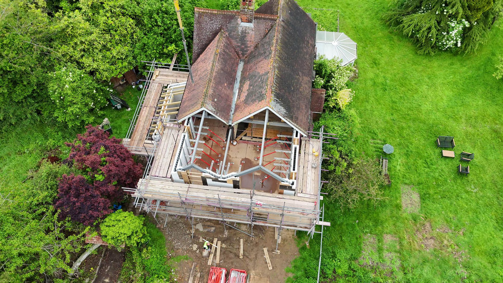 Aerial view showing house extension mid-build with insulated concrete framework. 