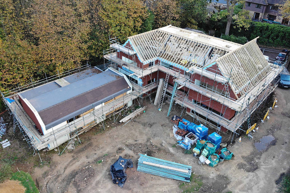 Overhead view of large house mid-build with scaffolding and insulated concrete form