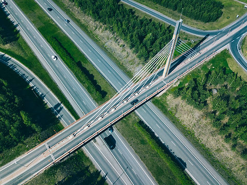 Aerial view of bridge over highway road in Finland. Beautiful summer landscape..jpg