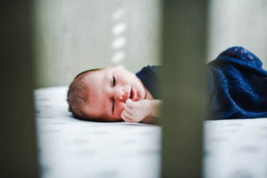 newborn baby in crib