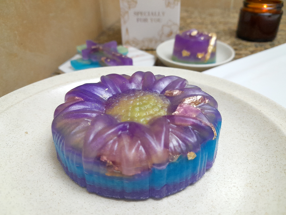 Thumbnail: sunflower-shaped soap bar (100g) with multiple shades of mica glitter and shiny copper flakes - displayed in bathroom