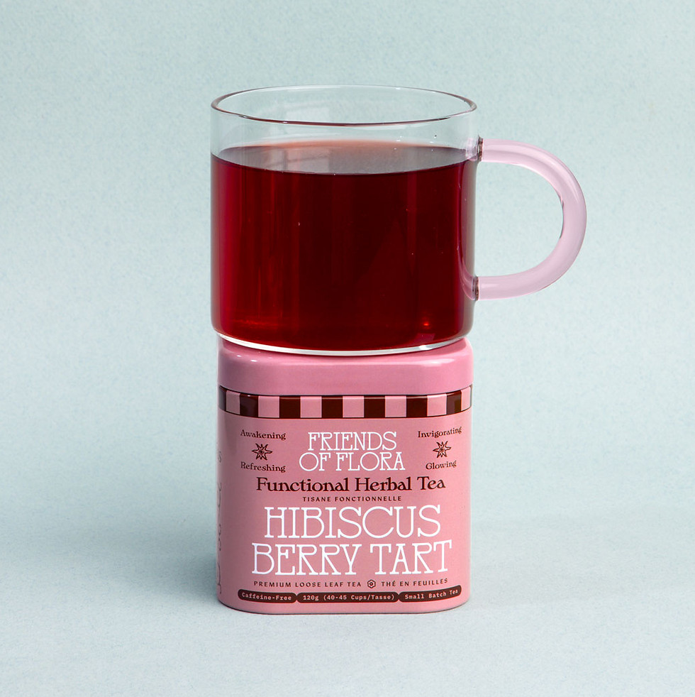 Hibiscus Berry Tart tea stacked on a tin on a blue background