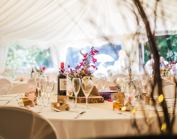 Anna and Jake's table setting at wedding in the woods