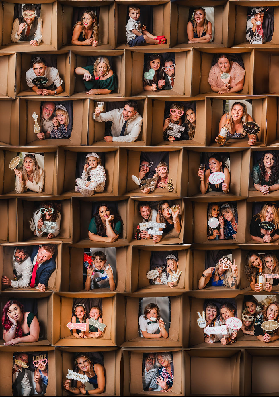 Collage of people in cardboard boxes, holding playful signs. Energetic, fun atmosphere with bright outfits and varied expressions.