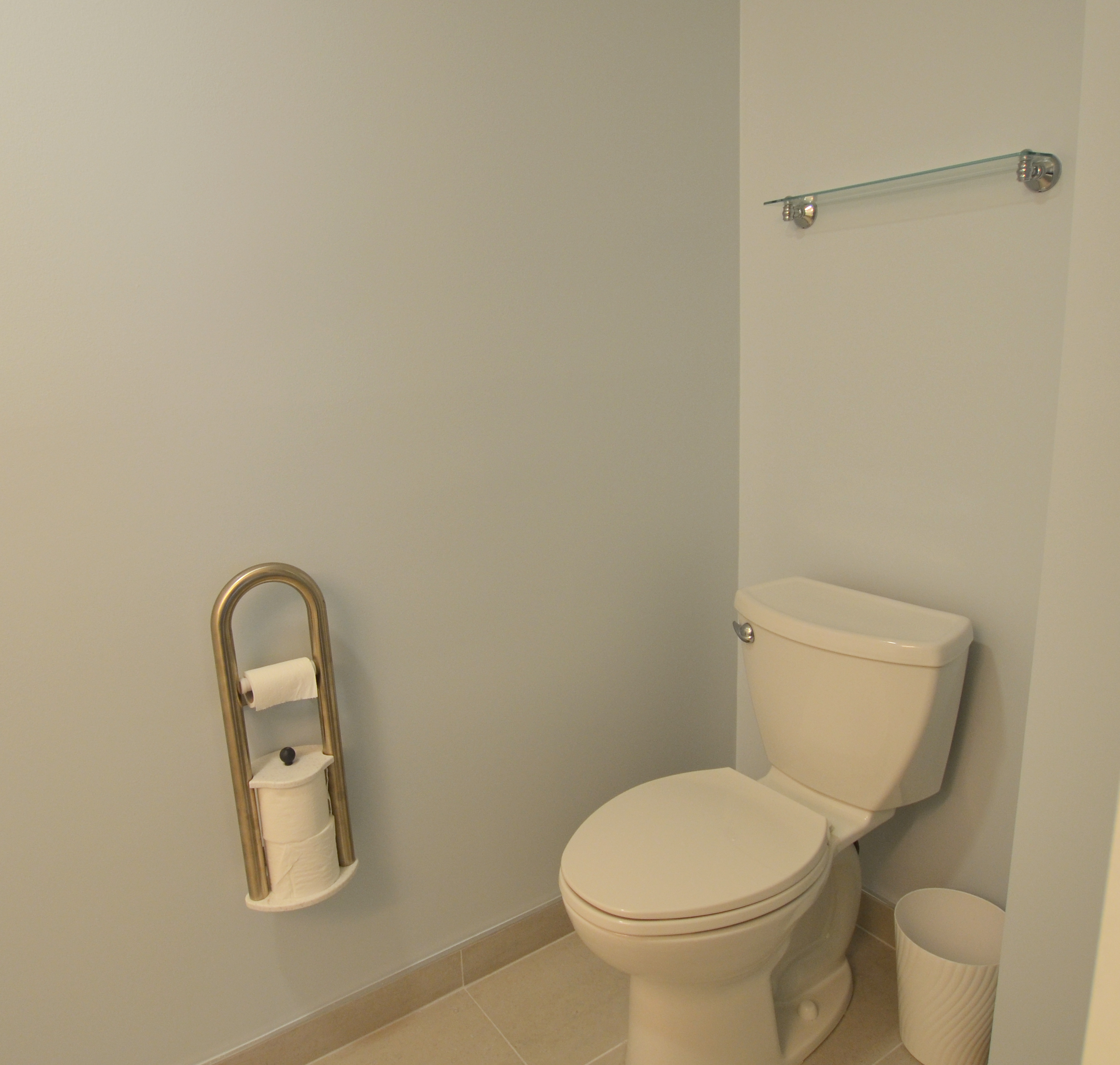 Toilet with Assist Roll Holder