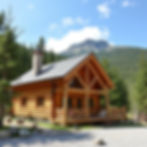 Log cabin in the New Hampshire mountains surrounded by pine trees