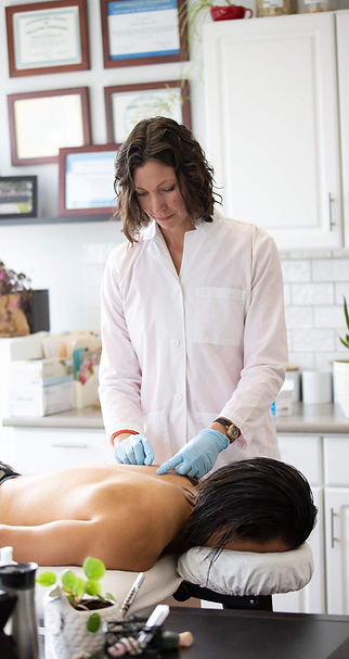 Dr. Amber McKinnon, naturopath for women's health doing acupuncture on patient