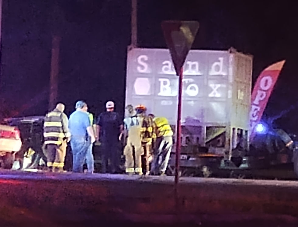 Kirbyville Firefighters and First Responders assess the situation. In the far left side of the photo, the back of the car can be seen where it slammed into the rug.