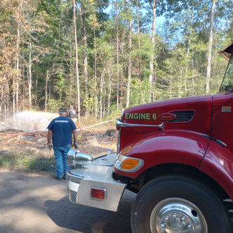 Woods fires reignite mere yards from one another