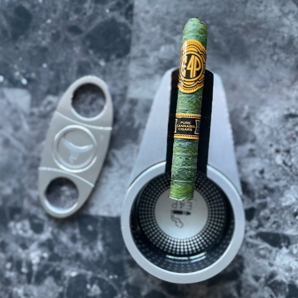 Learn how to make an all cannabis cigar (aka cannagar) wrapped in fan  leaves 