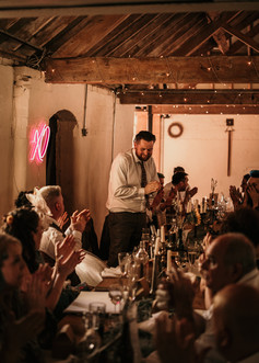 alternative groom reading his speech at DIY wedding