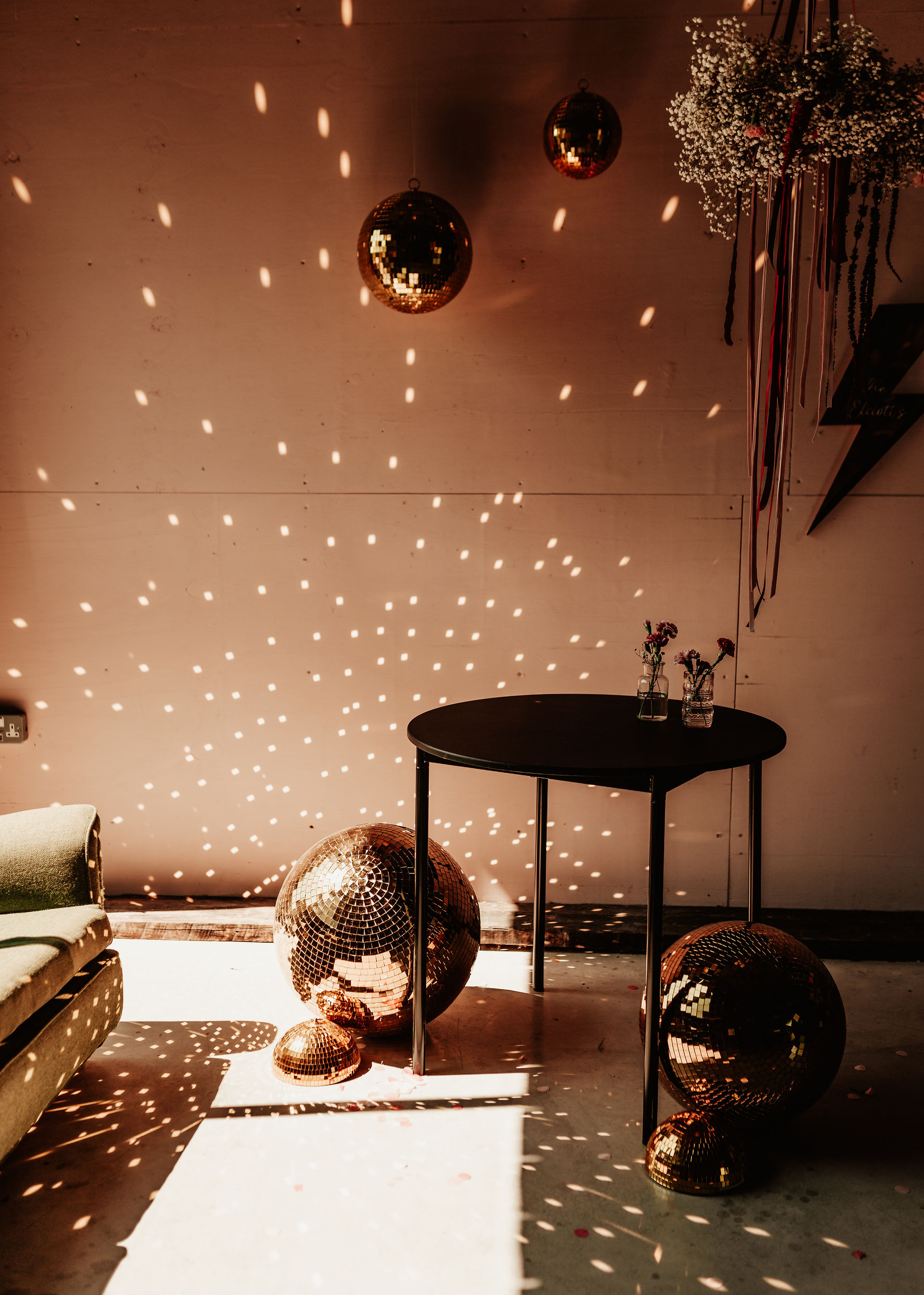 golden disco wedding decor glimmering in the sun