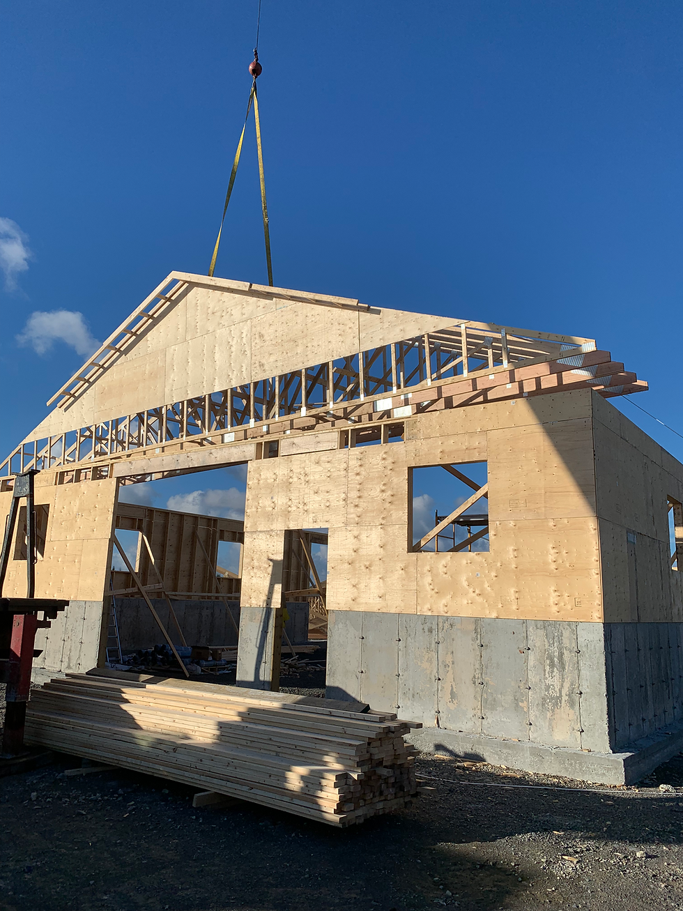 Murphy barn craning rafter sections in place.HEIC