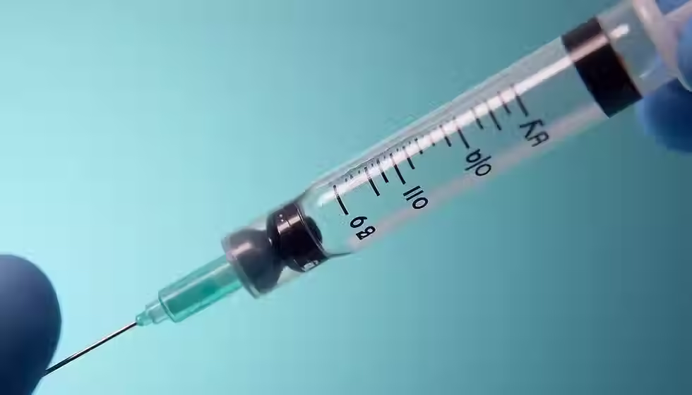 Close-up of dermal filler syringe used for smile line filler treatment