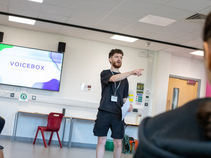 VoiceBox facilitating a workshop in a school