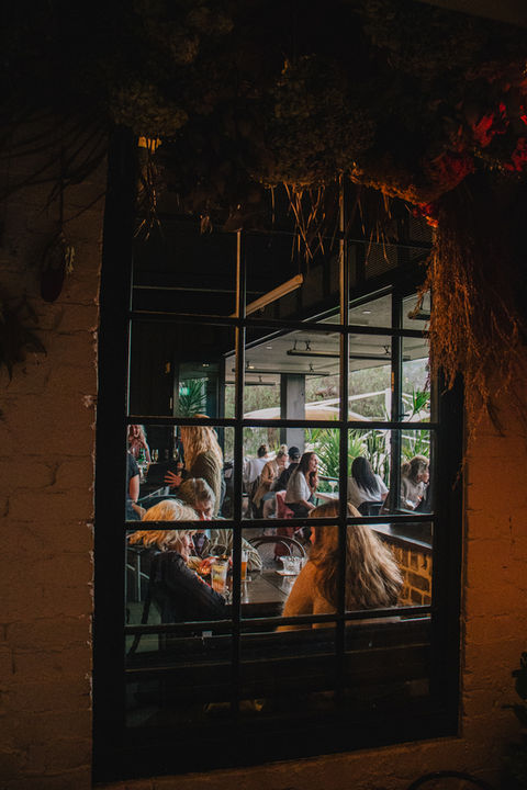Local crowd seen through one of our indoor windows.