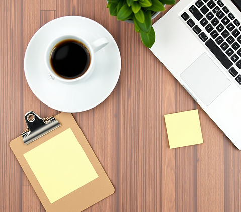 A branded flat lay (laptop + coffee + clipboard + sticky notes)