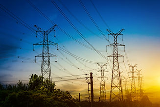 sun-setting-silhouette-electricity-pylons.jpg
