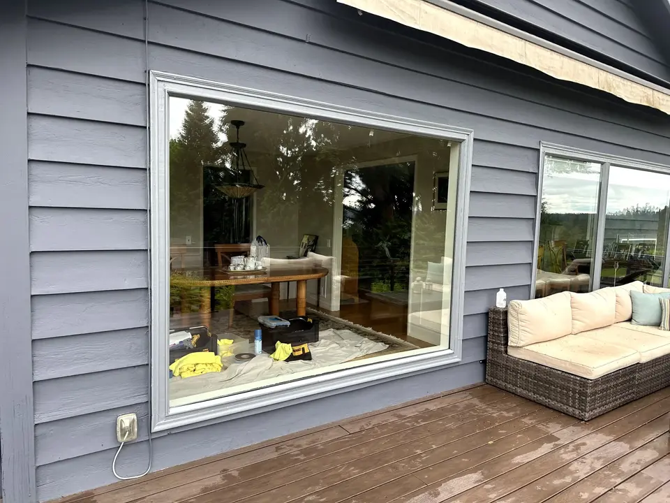glass window connecting the living room to the outdoor deck