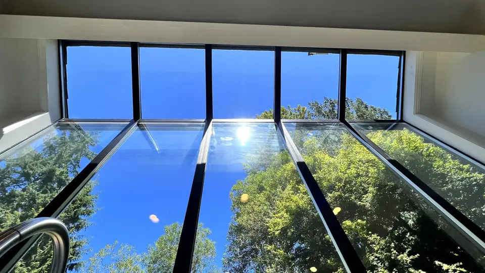 tall glass windows with glass rooftop