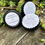Thumbnail: Three Herbal Salve tins on teak table with succulent