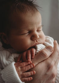 Newborn Photoshoot Southampton, newborn baby snuggled naturally in gentle light