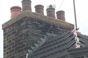 Brick chimney with leadwork on the roofing