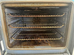 The dirty interior of an oven
