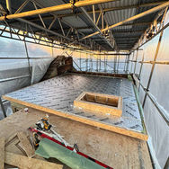 Loft conversion roof construction site under scaffolding protection