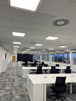 A commercial office space with a carpeted floor