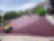 A professional refurbishing a driveway