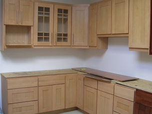 Oak kitchen units with glass fronted wall cabinets