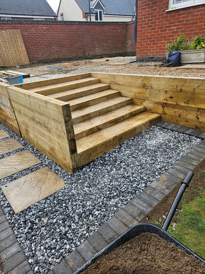 A wooden staircase with a patio
