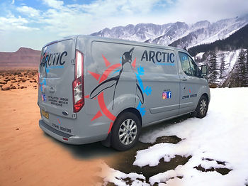 A grey van with the company name on it