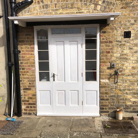 White front door with window panes