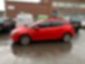 A red car with black tinted window panes