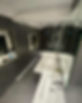 Side view of a bathroom with black walls