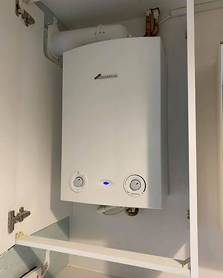 Worcester Bosch combi boiler installed in kitchen cupboard
