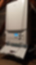 Wall-mounted gas boiler with digital display and control knobs