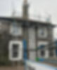 A house with scaffolding indicates ongoing exterior renovation