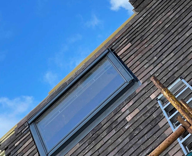 A skylight installed on the tiled roofing