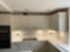 Kitchen with wall tiling and wooden cabinets