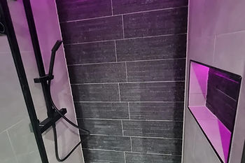 New bathroom installation with pink lighting
