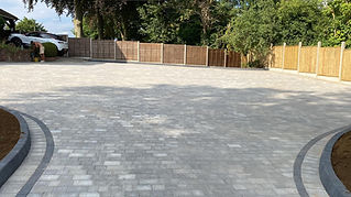 Block paving with wooden fencing